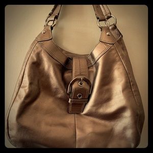 Metallic bronze Coach bag with many compartments